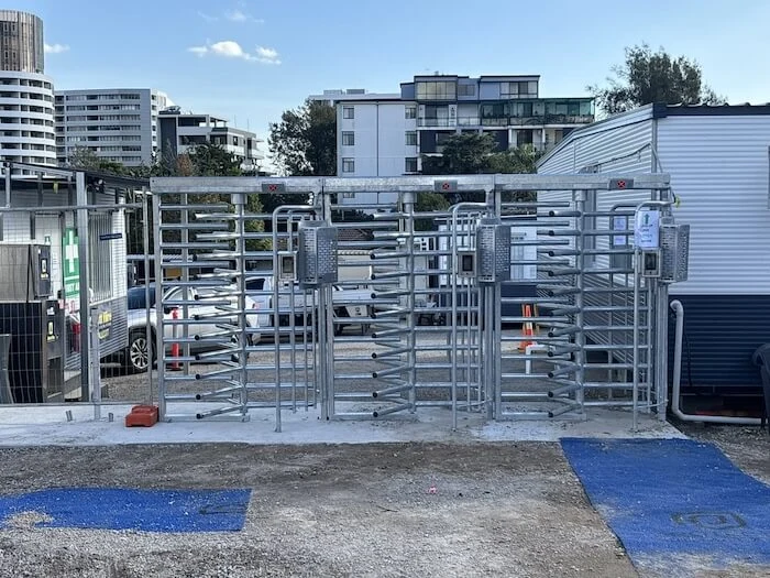 Outdoor entry with three controlled pedestrian lanes.